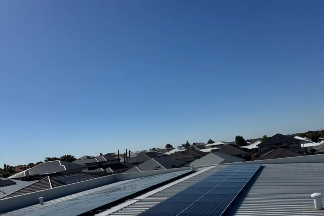 Commercial rooftop solar array installed on a metal roof