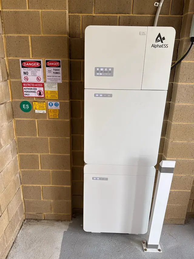 AlphaESS battery system installed in a garage corner
