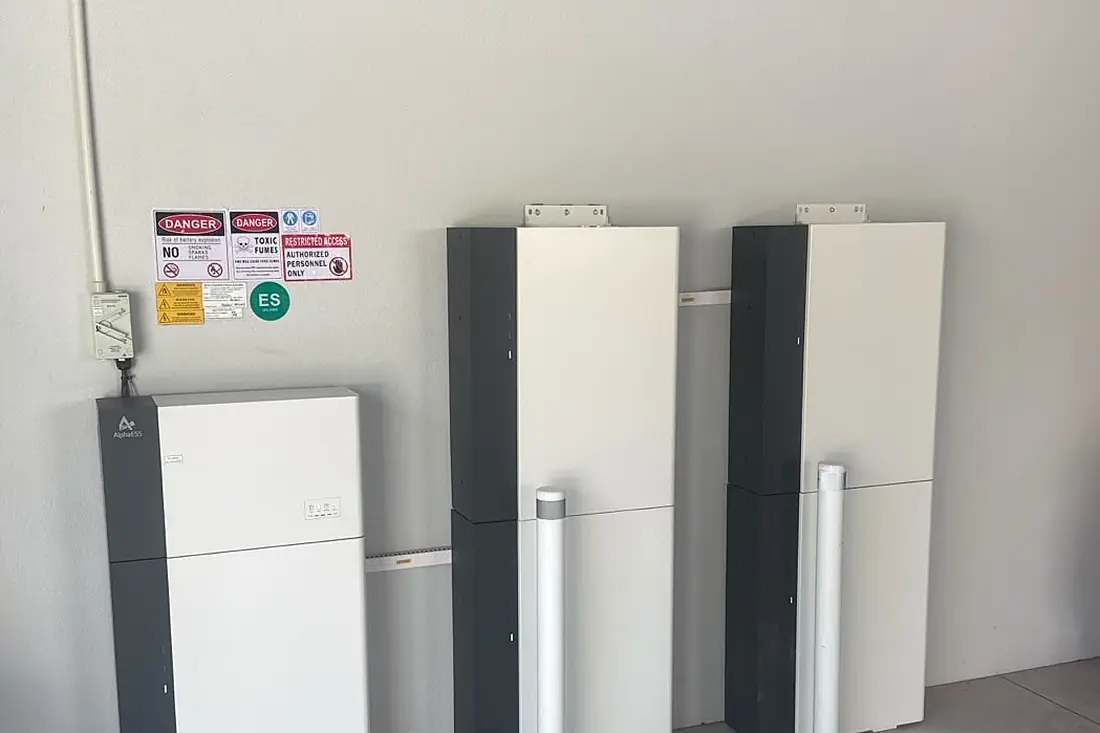 Multiple battery units installed side by side in a garage