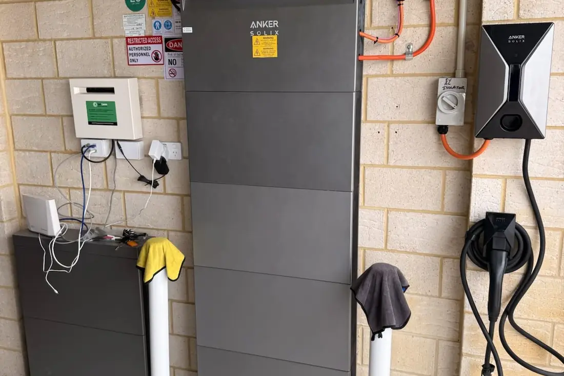 Anker home battery with two EV chargers installed in a garage