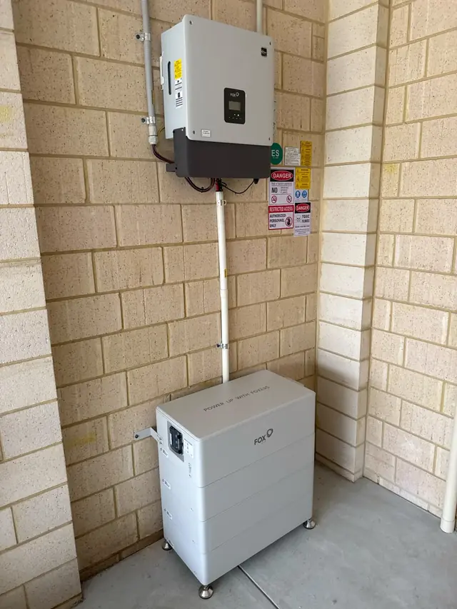Fox ESS battery and inverter installed in a garage corner